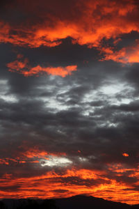 Low angle view of dramatic sky during sunset