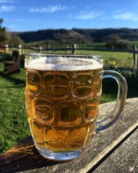 Close-up of beer glass on table