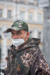 Portrait of mature man standing in park