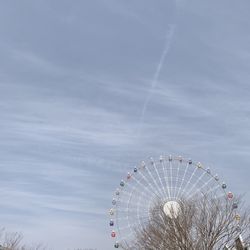 Low angle view of ferris wheel against sky