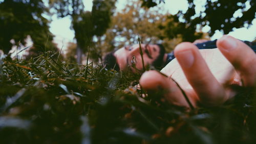 Portrait of smiling woman with plants in park