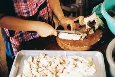 Midsection of man preparing food