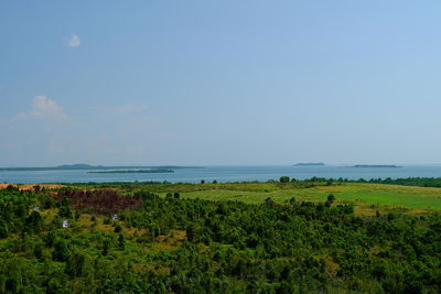 Scenic view of sea against blue sky