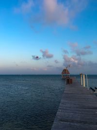 Pier over sea against sky