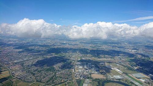 Aerial view of cityscape against sky