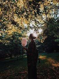 Young woman holding cotton candy