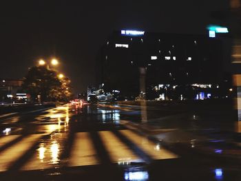 Cars on road in city at night