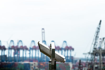 Close-up of cross against clear sky