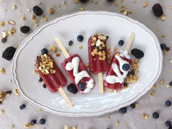 High angle view of popsicles in plate on table