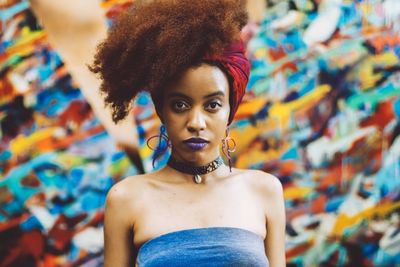 Portrait of beautiful young woman wearing multi colored outdoors