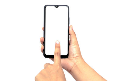 Midsection of person holding smart phone against white background