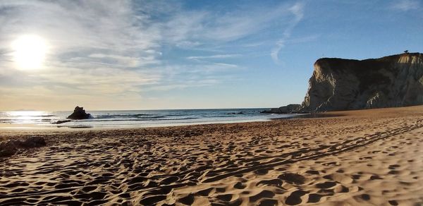 Scenic view of beach against sky