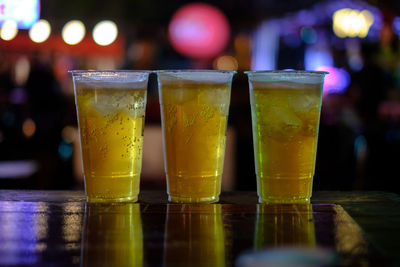 Close-up of beer glass on table