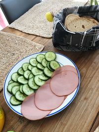 High angle view of fruits in plate on table