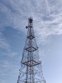 Low angle view of communications tower against sky