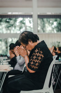 Rear view of couple sitting at restaurant