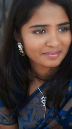 Close-up portrait of a smiling young woman