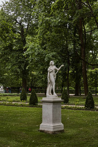 Statue against trees in park