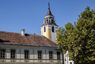 Low angle view of building against clear blue sky