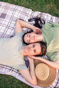 High angle portrait of man relaxing on bed