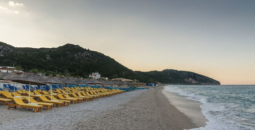 Scenic view of beach against sky during sunset