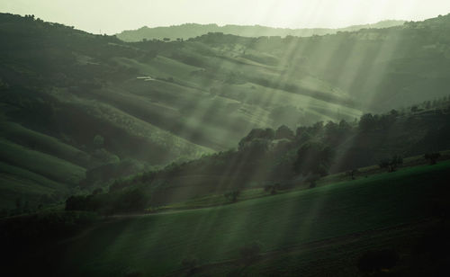 Scenic view of landscape and mountains against sky