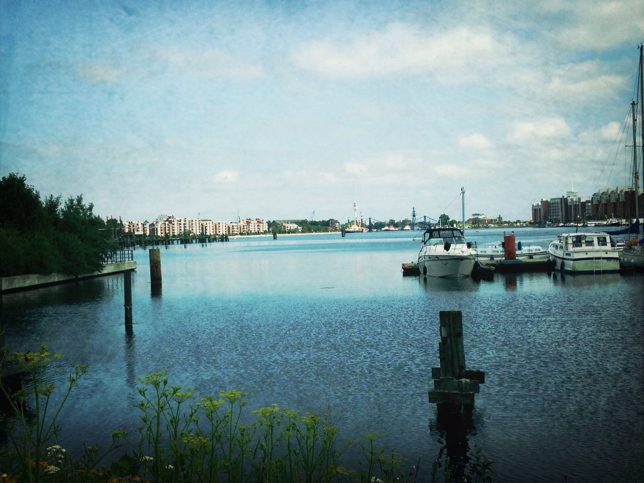 water, sky, tranquility, tranquil scene, lake, cloud - sky, reflection, nature, cloud, scenics, river, beauty in nature, tree, pier, transportation, built structure, sea, calm, blue, outdoors