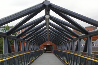 Empty walkway with bridge in background