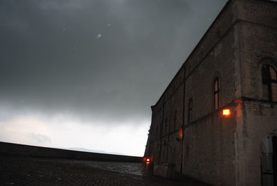 Low angle view of building against sky at dusk