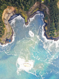 High angle view of water flowing through rocks