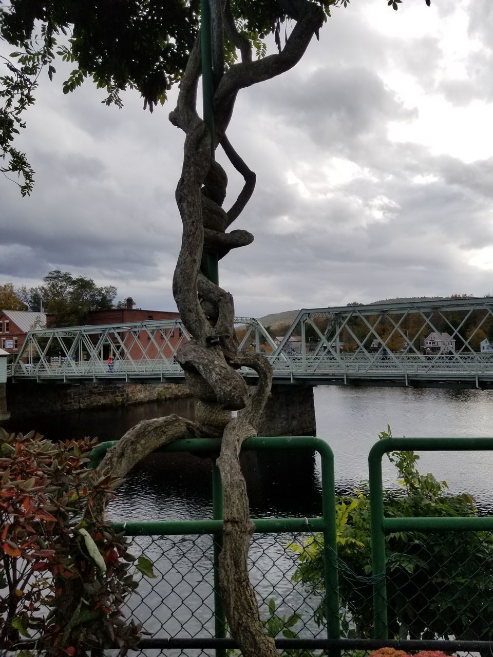 VIEW OF BRIDGE OVER RIVER AGAINST SKY