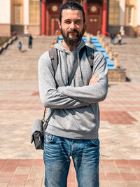 Portrait of smiling man standing outdoors