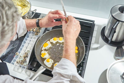 High angle view of man preparing food at home