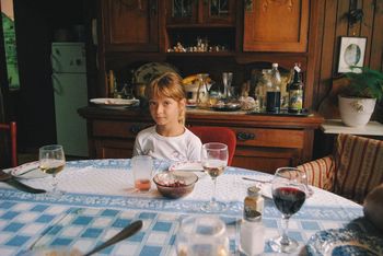 PORTRAIT OF GIRL SITTING ON TABLE