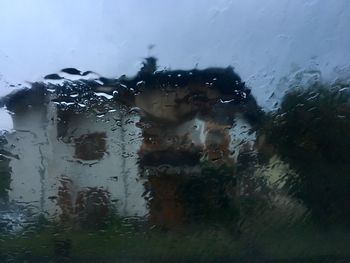 Full frame shot of wet glass window in rainy season