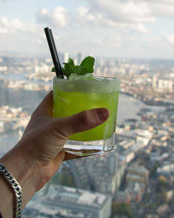 Close-up of hand holding drink