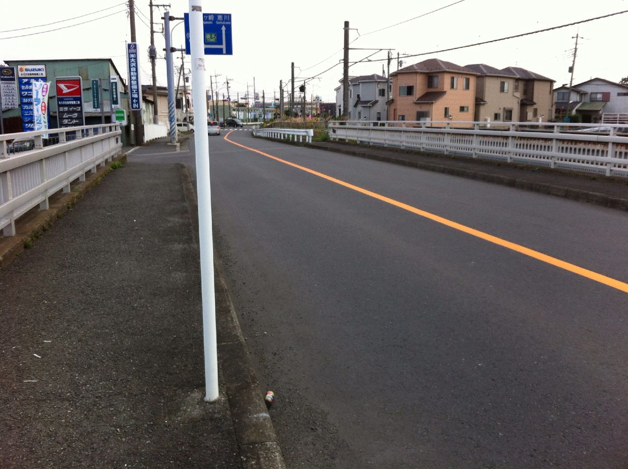 transportation, railroad track, the way forward, building exterior, built structure, architecture, diminishing perspective, rail transportation, vanishing point, road, street, public transportation, road marking, railroad station platform, surface level, empty, asphalt, power line, city, tramway