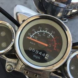 Close-up of motorcycle speedometer