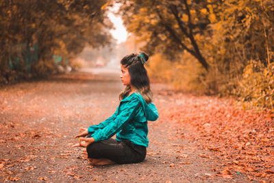 Full length of man wearing mask in park during autumn