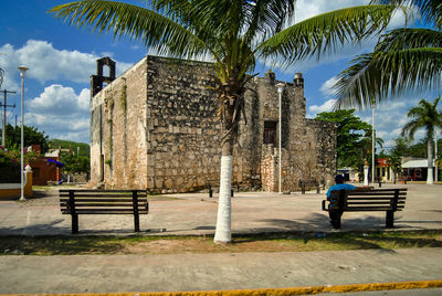 View of empty bench in front of building