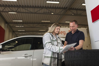 Woman in car dealership office