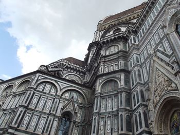 Low angle view of cathedral against cloudy sky