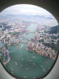 High angle view of cityscape seen through window