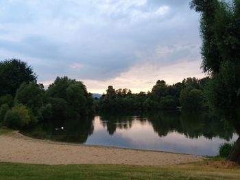 Scenic view of lake against sky during sunset