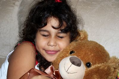 Cute child woman with cuddly teddy bear
