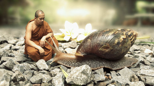 Man sitting on rock