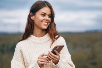 Young woman using mobile phone