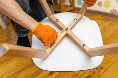 Cropped hand of man working on table