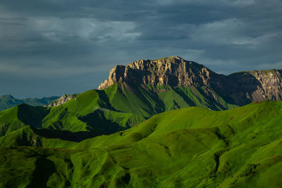 Beautiful green mountains. scenic view of mountain against sky