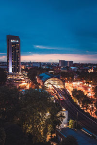 High angle view of illuminated buildings against sky at night